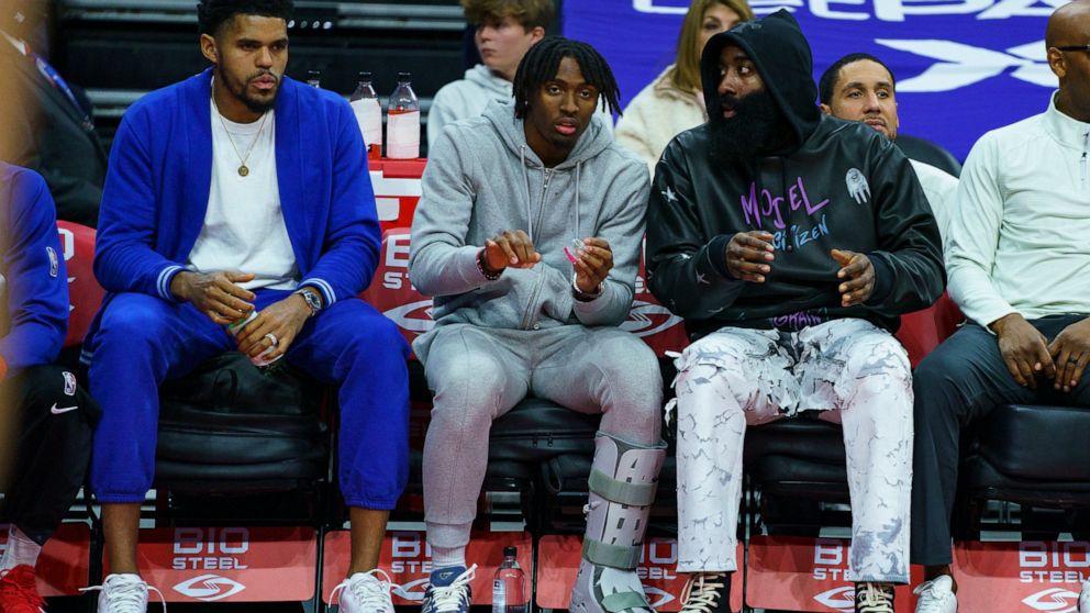 Philadelphia 76ers' Tobias Harris, left, Tyrese Maxey, center, and James Harden, right, look on from the bench during the second half of an NBA basketball game against the Minnesota Timberwolves, Saturday, Nov. 19, 2022, in Philadelphia. (AP Photo/Ch