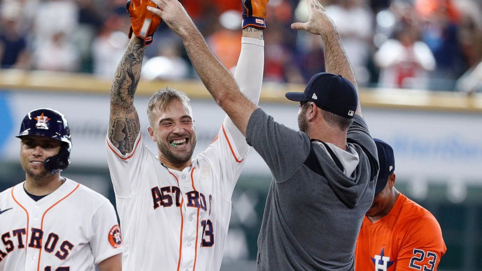 Houston Astros pinch hitter J.J. Matijevic, second from left, celebrates with Justin Verlander after hitting a walkoff single during the ninth inning in the first game of a baseball doubleheader against the New York Yankees, Thursday, July 21, 2022, 