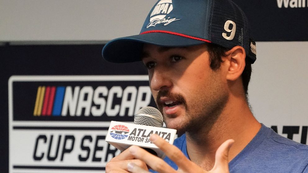 FILE - Driver Chase Elliott speaks to the media during a weather delay before qualifying the NASCAR Cup Series auto race at Atlanta Motor Speedway in Hampton, Ga., on Saturday, July 9, 2022. The regular-season champion's day was done early after a wr