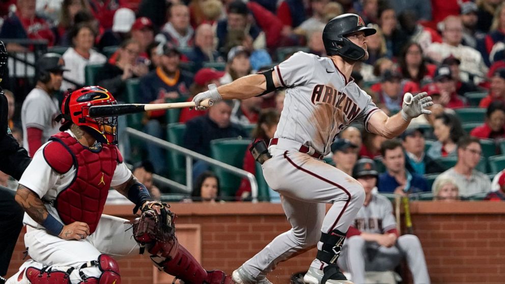 Arizona Diamondbacks' Cooper Hummel watches his RBI single during the sixth inning of a baseball game against the St. Louis Cardinals Friday, April 29, 2022, in St. Louis. (AP Photo/Jeff Roberson)