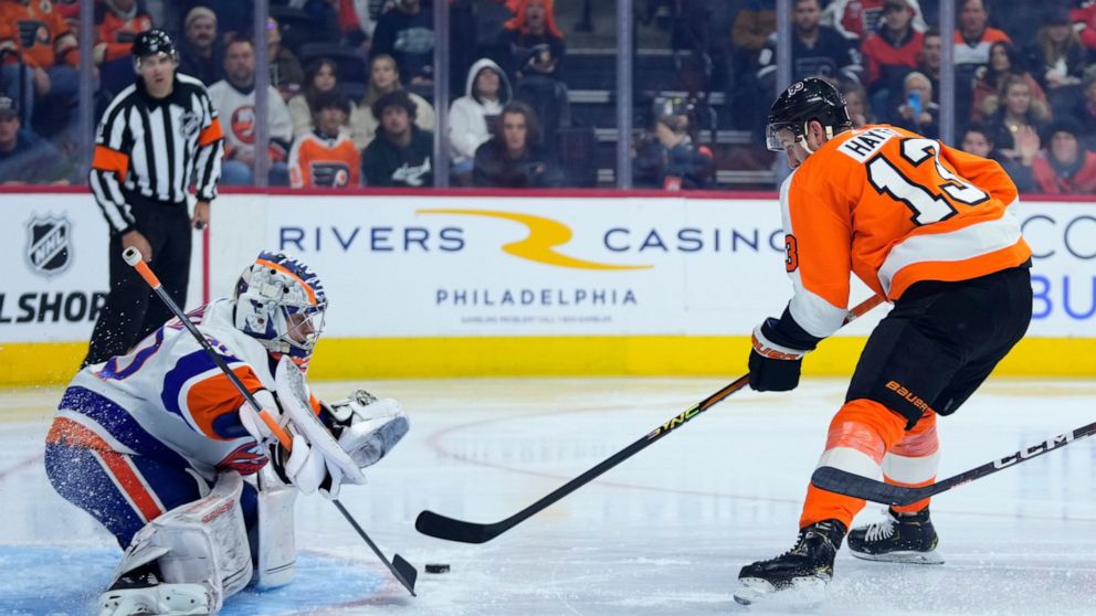 Philadelphia Flyers' Kevin Hayes, right, cannot get a shot past New York Islanders' Ilya Sorokin during the second period of an NHL hockey game, Tuesday, Nov. 29, 2022, in Philadelphia. (AP Photo/Matt Slocum)