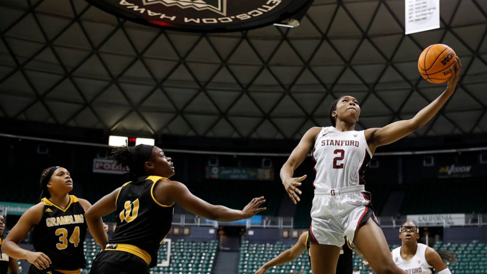Stanford guard Agnes Emma-Nnopu (2) goes for a layup over Grambling State guard Leah Morrow and guard DeMya Young during the fourth quarter of an NCAA college basketball game, Saturday, Nov. 26, 2022, in Honolulu. (AP Photo/Marco Garcia)