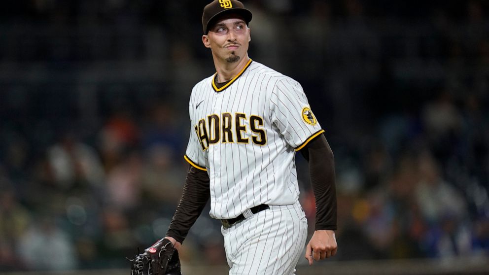 San Diego Padres starting pitcher Blake Snell walks toward the dugout after the top of the sixth inning of the team's baseball game against the New York Mets, Friday, June 4, 2021, in San Diego. (AP Photo/Gregory Bull)