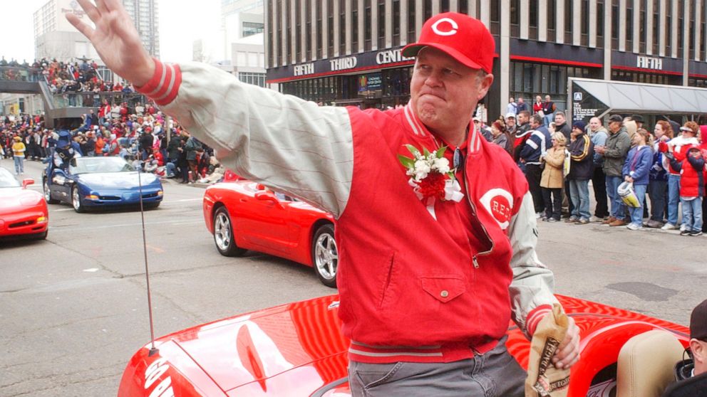 FILE - Former Cincinnati Reds pitcher Tom Browning waves during the Findlay Market Parade through downtown Cincinnati, March 31, 2003. Browning was grand marshall for the parade. Browning, an All-Star pitcher who threw the only perfect game in Cincin