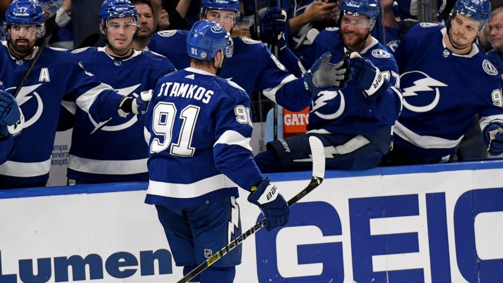 Tampa Bay Lightning center Steven Stamkos (91) celebrates his goal during the second period of an NHL hockey game against the Columbus Blue Jackets Tuesday, April 26, 2022, in Tampa, Fla. The goal gave Stamkos 100 points this season. (AP Photo/Jason 