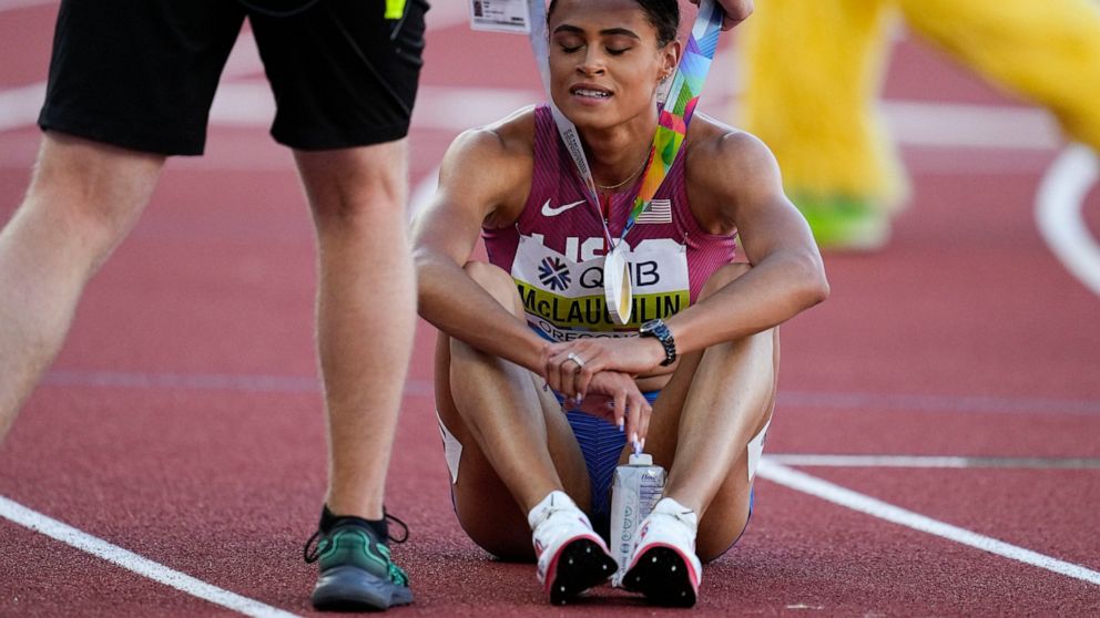 Sydney Mclaughlin, of the United States, receives her Gold medal after the final of the women's 400-meter hurdles at the World Athletics Championships on Friday, July 22, 2022, in Eugene, Ore. (AP Photo/Ashley Landis)