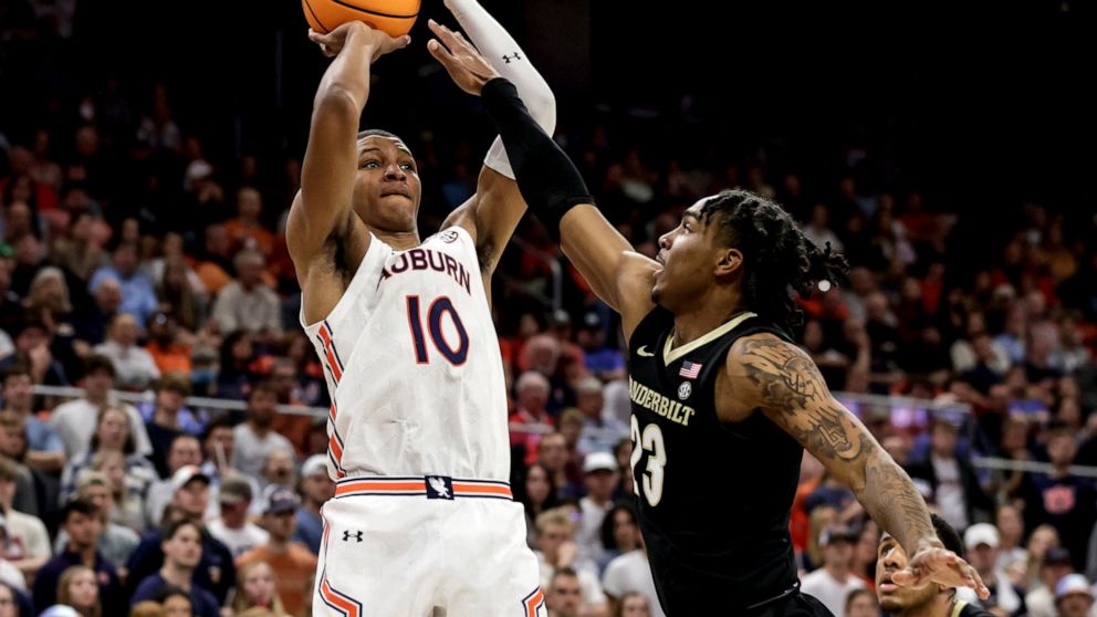 FILE - Auburn forward Jabari Smith (10) shoots a 3-pointer over Vanderbilt guard Jamaine Mann (23) during the second half of an NCAA college basketball game Feb. 16, 2022, in Auburn, Ala. Smith is one of the top forwards in the upcoming NBA draft. (A