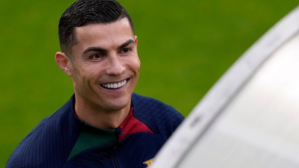 Cristiano Ronaldo smiles as he arrives for a Portugal soccer team training session in Oeiras, outside Lisbon, Monday, Nov. 14, 2022. Portugal will play Nigeria Thursday in a friendly match in Lisbon before departing to Qatar on Friday for the World C