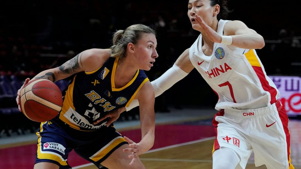 Bosnia and Herzegovina's Matea Tavic attempts to get past China's Yang Liwei during their game at the women's Basketball World Cup in Sydney, Australia, Friday, Sept. 23, 2022. (AP Photo/Mark Baker)