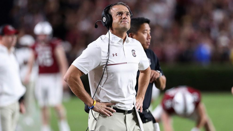 South Carolina coach Shane Beamer checks the scoreboard during the first half of the team's NCAA college football game against Charlotte on Saturday, Sept. 24, 2022, in Columbia, S.C. (AP Photo/Artie Walker Jr.)