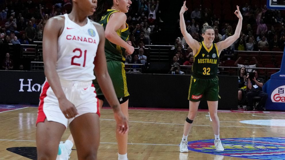 Australia's Sami Whitcomb reacts after shooting a goal during their game at the women's Basketball World Cup against Canada in Sydney, Australia, Monday, Sept. 26, 2022. (AP Photo/Mark Baker)
