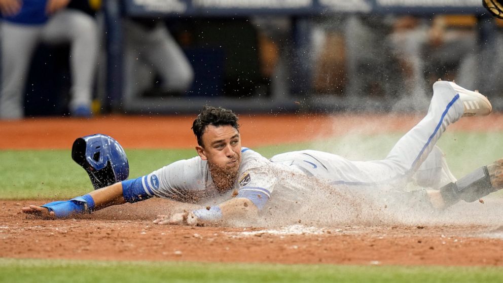 Kansas City Royals' Nicky Lopez scores on a sacrifice fly by Bobby Witt Jr., off Tampa Bay Rays relief pitcher Shawn Armstrong during the fifth inning of a baseball game Sunday, Aug. 21, 2022, in St. Petersburg, Fla. (AP Photo/Chris O'Meara)