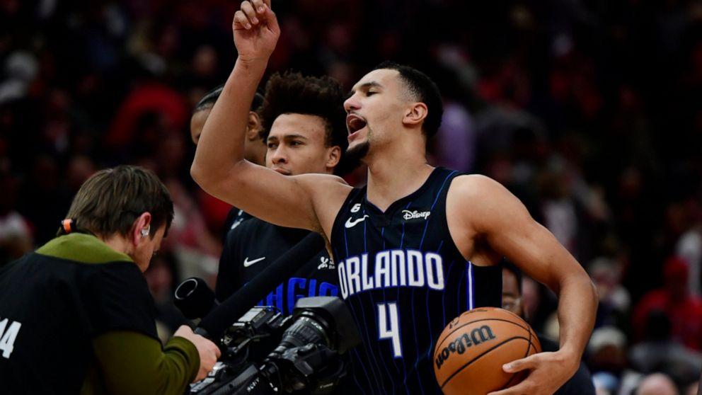 Orlando Magic's Jalen Suggs (4) celebrates after scoring the winning basket to defeat the Chicago Bulls in an NBA basketball game Friday, Nov. 18, 2022, in Chicago. (AP Photo/Paul Beaty)