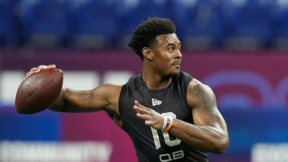 FILE - Liberty quarterback Malik Willis runs a drill during the NFL football scouting combine, Thursday, March 3, 2022, in Indianapolis. Franchises still searching for a prized quarterback won't find much star power in this year's crop of college QBs