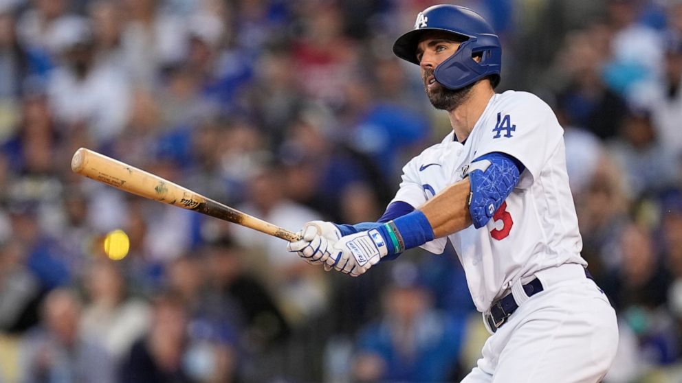 Los Angeles Dodgers' Chris Taylor watches his two-run home run in the second inning against the Atlanta Braves in Game 5 of baseball's National League Championship Series Thursday, Oct. 21, 2021, in Los Angeles. Pujols scored on the hit. (AP Photo/Ja