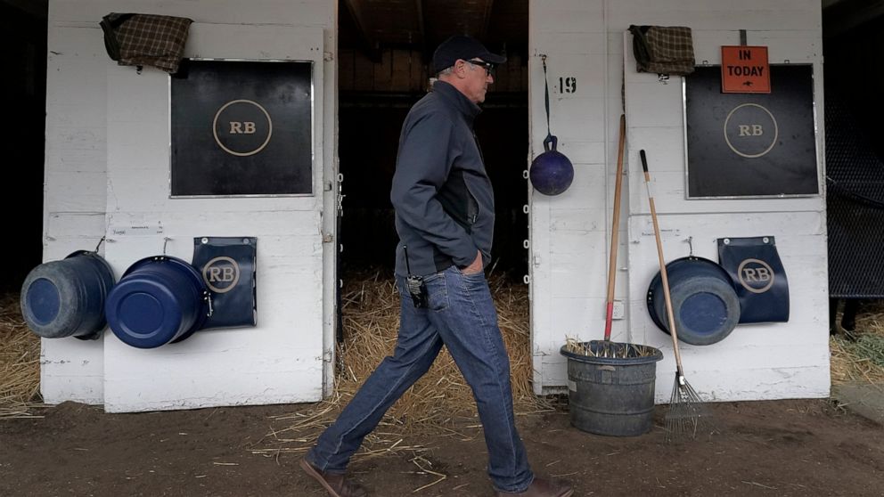 Trainer Tim Yakteen walks though his barn after taking Kentucky Derby entrants Tabia and Messier for workouts at Churchill Downs Wednesday, May 4, 2022, in Louisville, Ky. The 148th running of the Kentucky Derby is scheduled for Saturday, May 7. (AP 