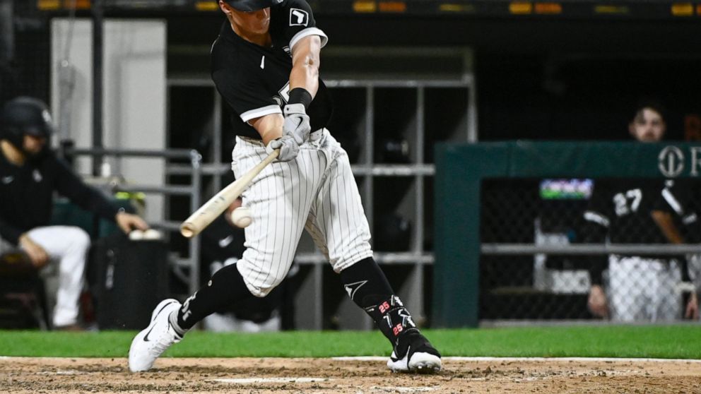 Chicago White Sox's Andrew Vaughn hits an RBI single against the Detroit Tigers during the seventh inning of a baseball game Saturday, Aug. 13, 2022, in Chicago. (AP Photo/Matt Marton)