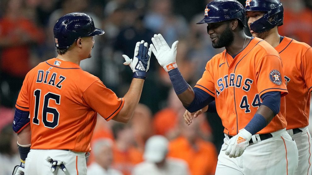Houston Astros' Yordan Alvarez (44) celebrates with Aledmys Diaz (16) after hitting a two-run home run against the Seattle Mariners during the third inning of a baseball game Friday, Aug. 20, 2021, in Houston. (AP Photo/David J. Phillip)