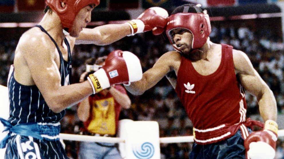 FILE - In this Oct. 2, 1988, file photo, South Korea's Park Si-hun, left, delivers a left jab to America's Roy Jones, and goes on to win the gold medal in the gold medal bout of the light middleweight division at the summer Olympics in Seoul, South K