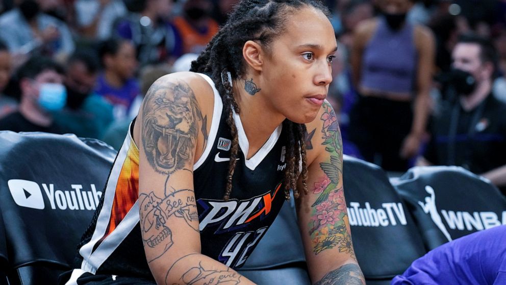 FILE - Phoenix Mercury center Brittney Griner sits during the first half of Game 2 of basketball's WNBA Finals against the Chicago Sky, Wednesday, Oct. 13, 2021, in Phoenix. Brittney Griner said she's “grateful” to be back in the United States and pl