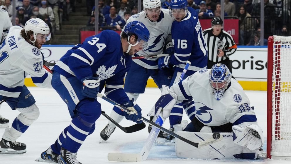 Tampa Bay Lightning goaltender Andrei Vasilevskiy (88) makes a save on Toronto Maple Leafs center Auston Matthews (34) during the second period of Game 5 of an NHL hockey Stanley Cup first-round playoff series, Tuesday, May 10, 2022 in Toronto. (Nath