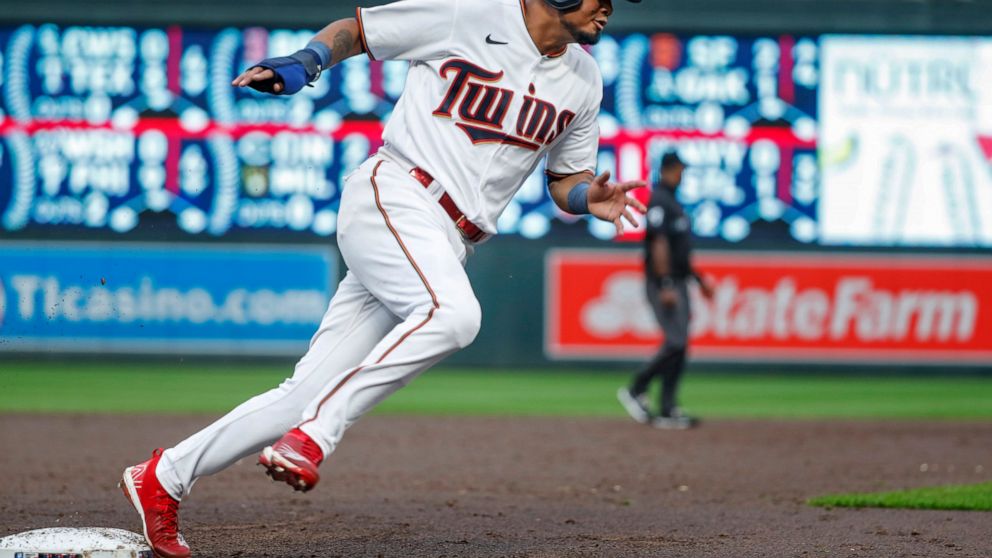 Minnesota Twins' Luis Arraez rounds third base en route to scoring against the Toronto Blue Jays on a single by Jorge Polanco during the third inning of a baseball game Saturday, Aug. 6, 2022, in Minneapolis. (AP Photo/Bruce Kluckhohn)