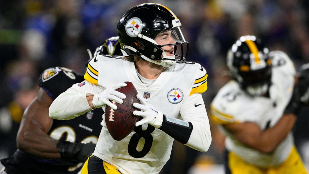Pittsburgh Steelers quarterback Kenny Pickett (8) throws against the Baltimore Ravens in the first half of an NFL football game in Baltimore, Sunday, Jan. 1, 2023. (AP Photo/Nick Wass)