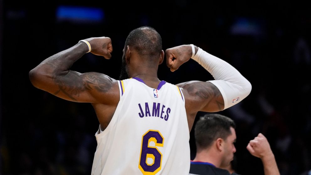 Los Angeles Lakers' LeBron James (6) flexes his arms after drawing a foul during the second half of an NBA basketball game against the Washington Wizards Sunday, Dec. 18, 2022, in Los Angeles. (AP Photo/Jae C. Hong)