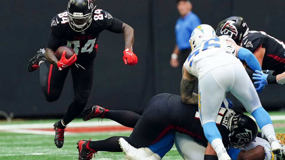 Atlanta Falcons running back Cordarrelle Patterson (84) carries the ball up field during the first half of an NFL football game against the Los Angeles Chargers, Sunday, Nov. 6, 2022, in Atlanta. (AP Photo/John Bazemore)