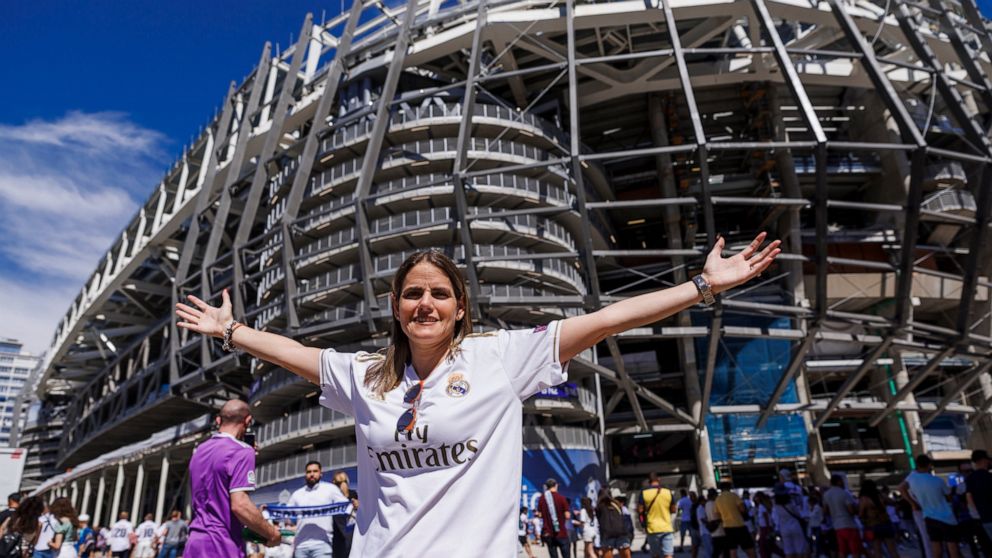 Maria Garcia-Mella Cid poses outside the Santiago Bernabeu stadium prior a Spanish La Liga soccer match between Real Madrid and Betis in Madrid, Spain, Saturday, Sept. 3, 2022. This past weekend, the 41-year-old Garcia-Mella enjoyed a day she could h