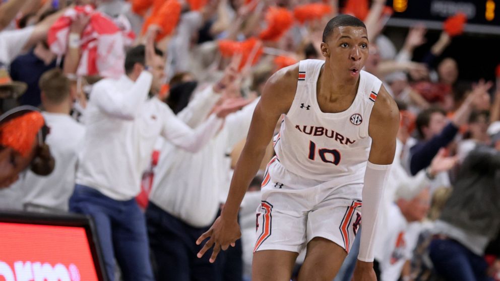 FILE - Auburn forward Jabari Smith (10) reacts after making a 3-pointer against Alabama during the first half of an NCAA college basketball game Tuesday, Feb. 1, 2022, in Auburn, Ala. Houston, Detroit and Orlando share the best odds to win the draft 