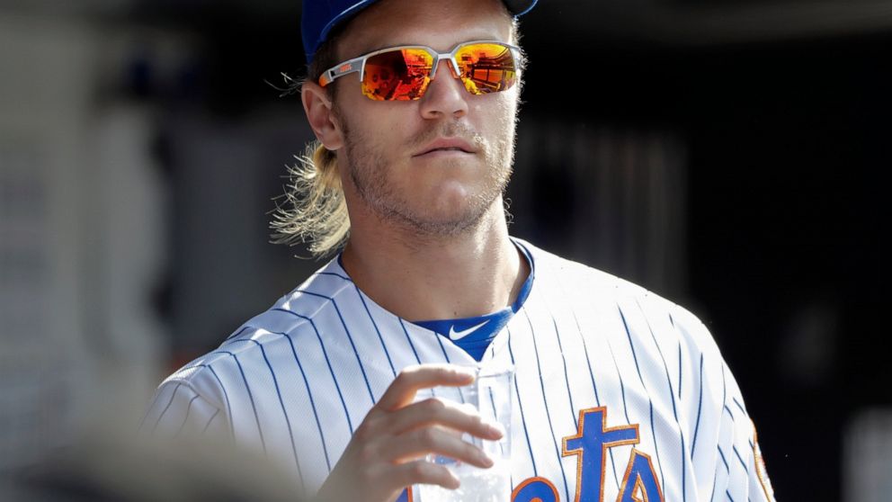 New York Mets pitcher Noah Syndergaard watches his team play during the eighth inning of a baseball game against the Pittsburgh Pirates, Sunday, July 28, 2019, in New York. (AP Photo/Frank Franklin II)