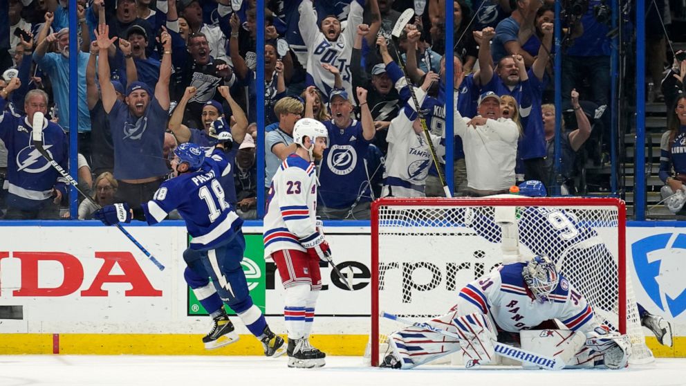 Tampa Bay Lightning left wing Ondrej Palat (18) reacts after scoring past New York Rangers goaltender Igor Shesterkin (31) during the third period in Game 3 of the NHL hockey Stanley Cup playoffs Eastern Conference finals Sunday, June 5, 2022, in Tam