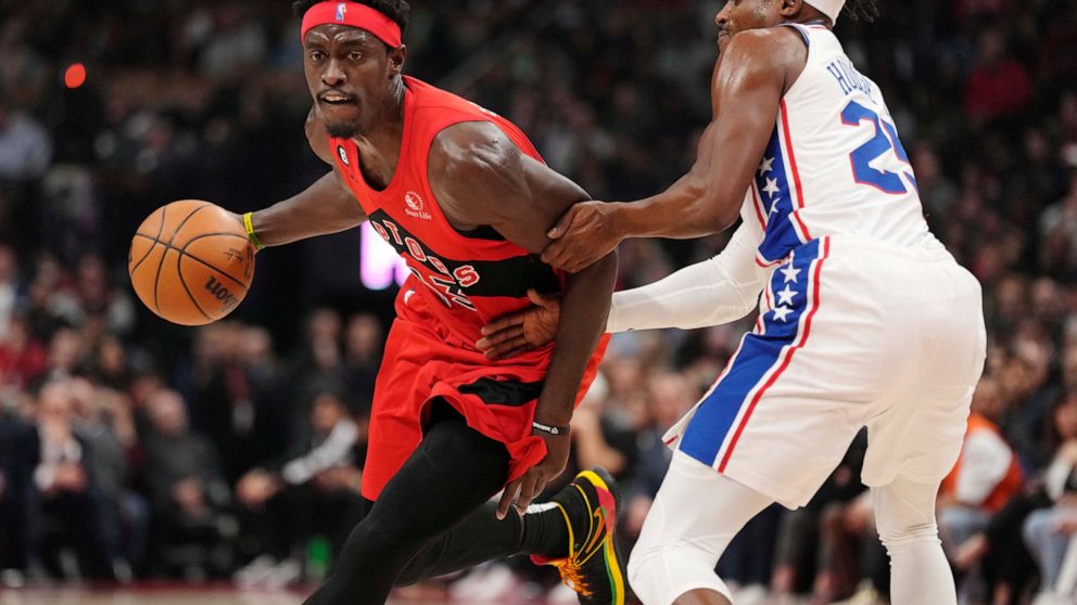 Toronto Raptors forward Pascal Siakam (43) drives past Philadelphia 76ers forward Danuel House Jr. (25) during the first half of an NBA basketball game, Wednesday, Oct. 26, 2022 in Toronto. (Frank Gunn/The Canadian Press via AP)