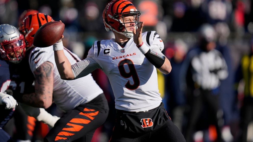 Cincinnati Bengals quarterback Joe Burrow (9) winds up to pass during the first half of an NFL football game against the New England Patriots, Saturday, Dec. 24, 2022, in Foxborough, Mass. (AP Photo/Charles Krupa)