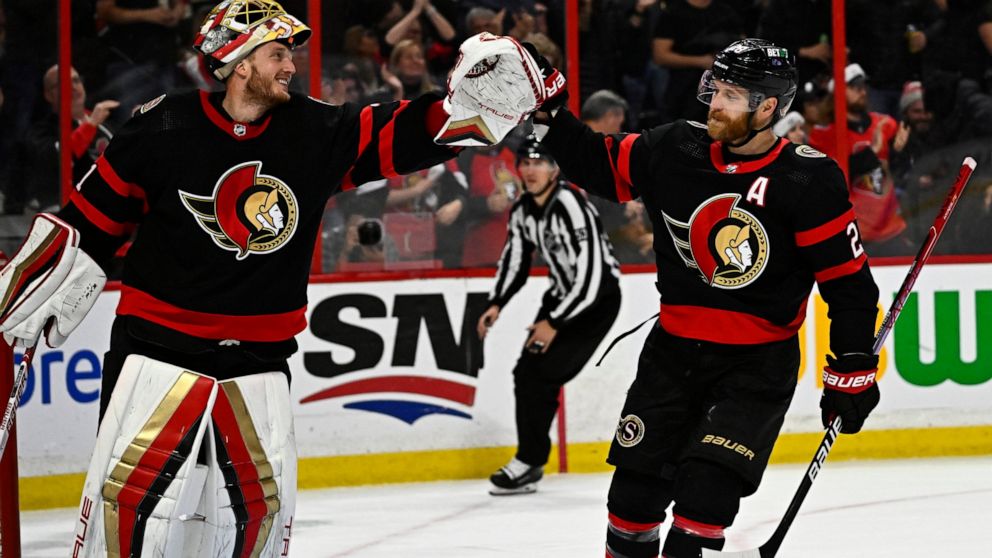 Ottawa Senators right wing Claude Giroux (28) celebrates his goal against the San Jose Sharks with goaltender Anton Forsberg (31) during third-period NHL hockey game action in Ottawa, Ontario, Saturday, Dec. 3, 2022. (Justin Tang/The Canadian Press v