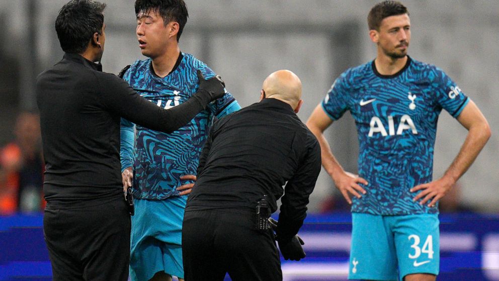 Tottenham's Son Heung-min receives treatment after taking a knock during the Champions League Group D soccer match between Marseille and Tottenham Hotspur at the Stade Velodrome in Marseille, France, Tuesday, Nov. 1, 2022. When Son Heung-min went dow