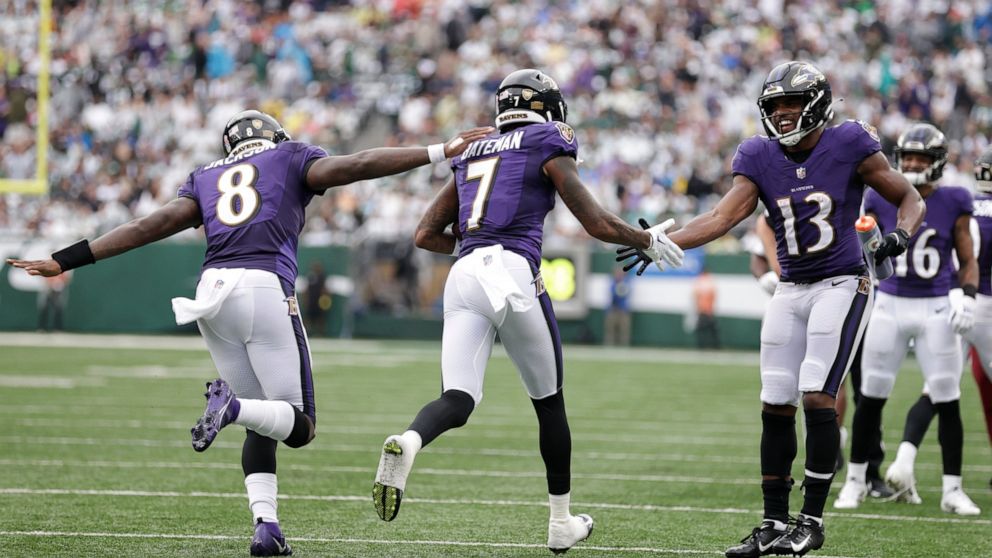 Baltimore Ravens wide receiver Rashod Bateman (7) celebrates with teammates Devin Duvernay (13) and quarterback Lamar Jackson (8) after scoring a touchdown during the second half of an NFL football game against the New York Jets, Sunday, Sept. 11, 20