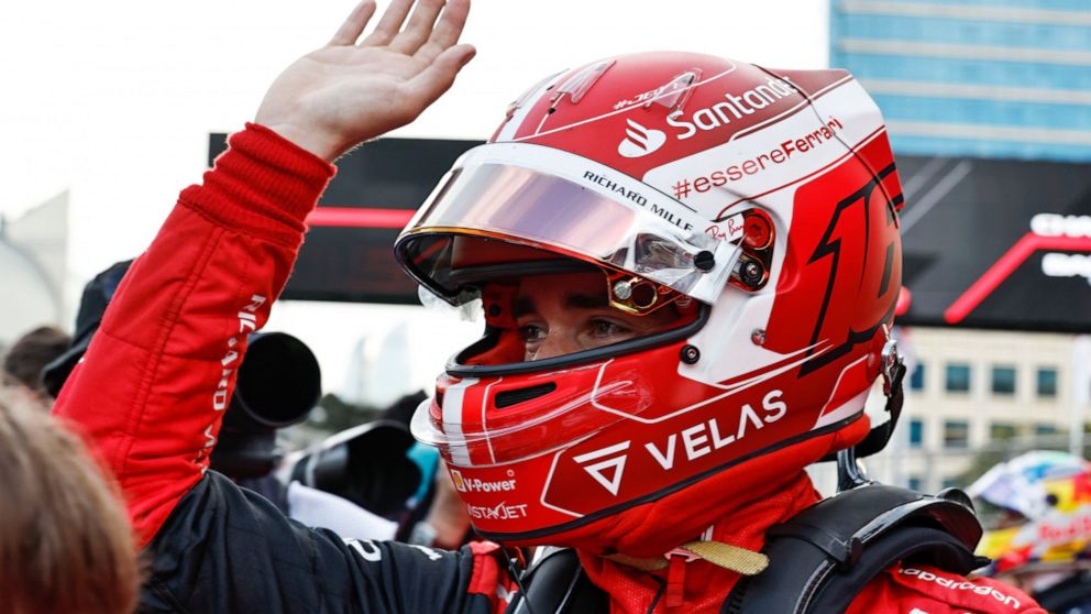 Ferrari driver Charles Leclerc of Monaco celebrates after setting the pole position in the qualifying session at the Baku circuit, in Baku, Azerbaijan, Saturday, June 11, 2022. The Formula One Grand Prix will be held on Sunday. (Hamad Mohammed, Pool 