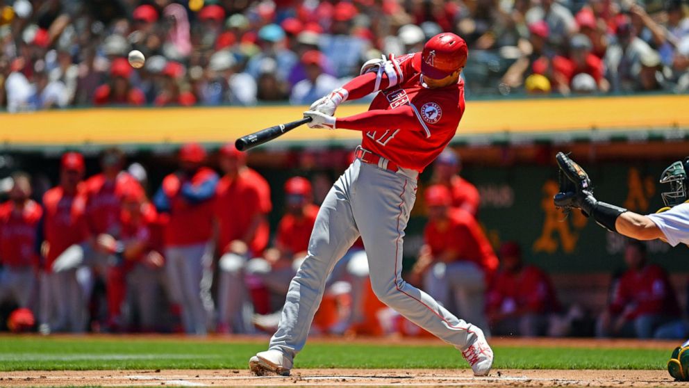 Los Angeles Angels' Shohei Ohtani (17) connects for a two-run home run against Oakland Athletics pitcher Frankie Montas (47) in the first Inning of a baseball game at the Coliseum in Oakland, Calif., on Sunday, May 15, 2022. This is Ohtani's 101st ca