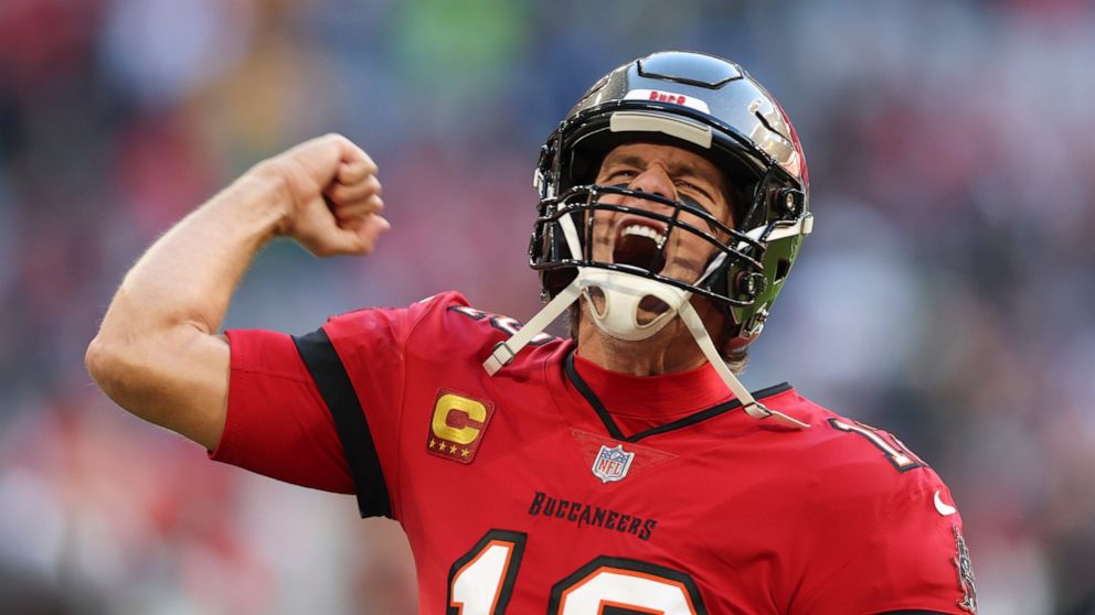 Tampa Bay Buccaneers quarterback Tom Brady runs onto the field before an NFL football game against the Seattle Seahawks, Sunday, Nov. 13, 2022, in Munich, Germany. (AP Photo/Gary McCullough)