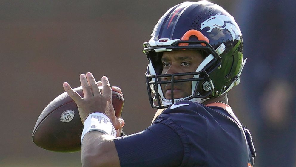 Denver Broncos quarterback Russell Wilson throws the ball during a practice session in Harrow, England, Wednesday, Oct. 26, 2022 ahead the NFL game against Jacksonville Jaguars at the Wembley stadium on Sunday. (AP Photo/Kin Cheung)