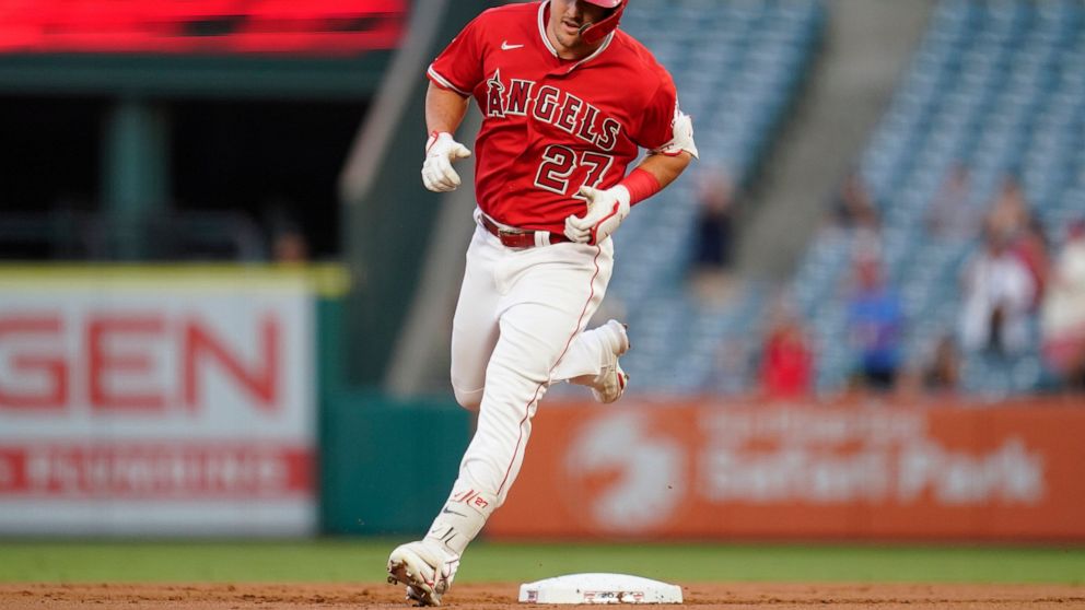 Los Angeles Angels' Mike Trout (27) runs the bases after hitting a home run during the first inning of a baseball game against the Detroit Tigers in Anaheim, Calif., Tuesday, Sept. 6, 2022. (AP Photo/Ashley Landis)