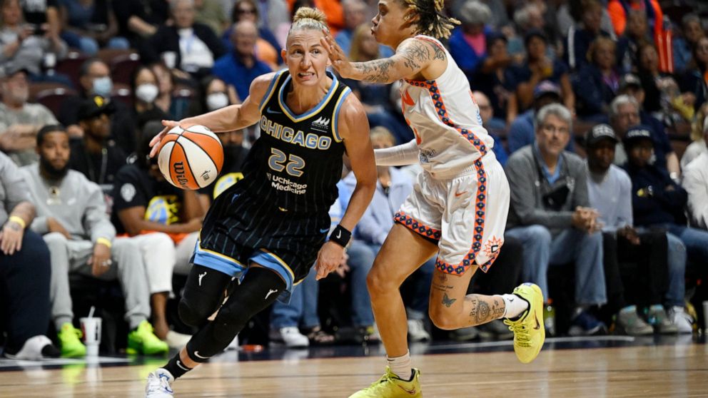 Chicago Sky guard Courtney Vandersloot drives to the basket as Connecticut Sun guard Natisha Hiedeman, right, defends during Game 4 of a WNBA basketball playoff semifinal Tuesday, Sept. 6, 2022, in Uncasville, Conn. (AP Photo/Jessica Hill)