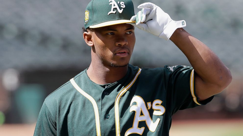 FILE - In this June 15, 2018, file photo, Oakland Athletics draft pick Kyler Murray looks on before a baseball game between the Athletics and the Los Angeles Angels in Oakland, Calif. Representatives of the Athletics and Major League Baseball met Sun