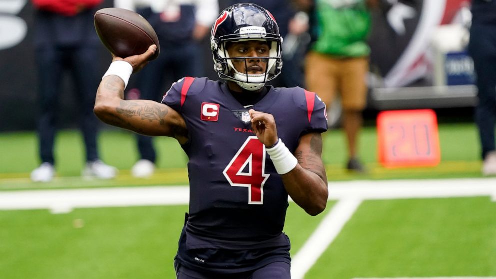 File-This Dec. 27, 2020, file photo shows Houston Texans quarterback Deshaun Watson (4) throwing a pass against the Cincinnati Bengals during the first half of an NFL football game in Houston. Watson plans to report to training camp with the Houston 
