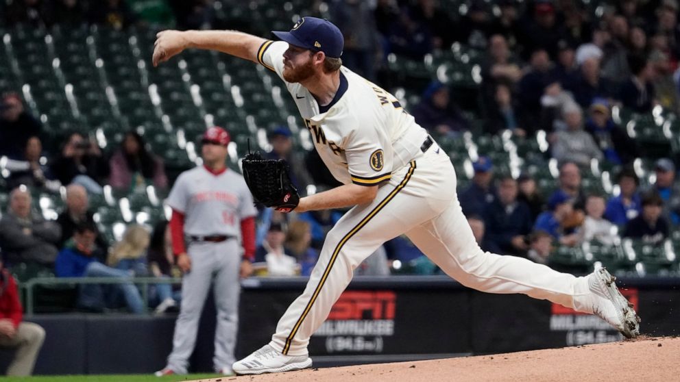 Milwaukee Brewers starting pitcher Brandon Woodruff throws during the first inning of a baseball game against the Cincinnati Reds Tuesday, May 3, 2022, in Milwaukee. (AP Photo/Morry Gash)