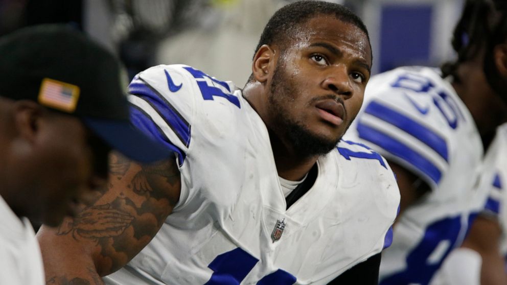 Dallas Cowboys linebacker Micah Parsons sits on the bench during the first half of an NFL football game against the Minnesota Vikings, Sunday, Nov. 20, 2022, in Minneapolis. (AP Photo/Andy Clayton-King)
