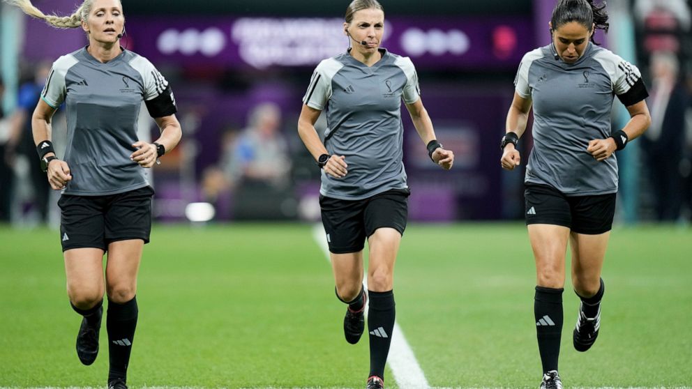 Referee Stephanie Frappart, center, assistants referee Neuza Back, left, and Karen Diaz warm up prior to the World Cup group E soccer match between Costa Rica and Germany at the Al Bayt Stadium in Al Khor , Qatar, Thursday, Dec. 1, 2022. (AP Photo/Ha