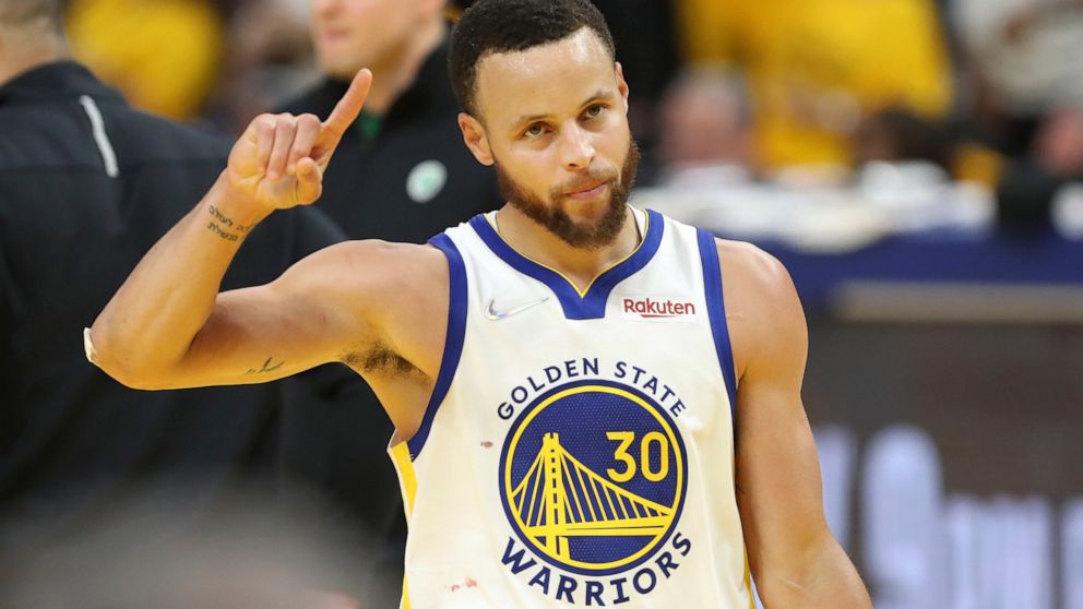 Golden State Warriors guard Stephen Curry (30) celebrates during the second half of Game 5 of basketball's NBA Finals against the Boston Celtics in San Francisco, Monday, June 13, 2022. (AP Photo/Jed Jacobsohn)